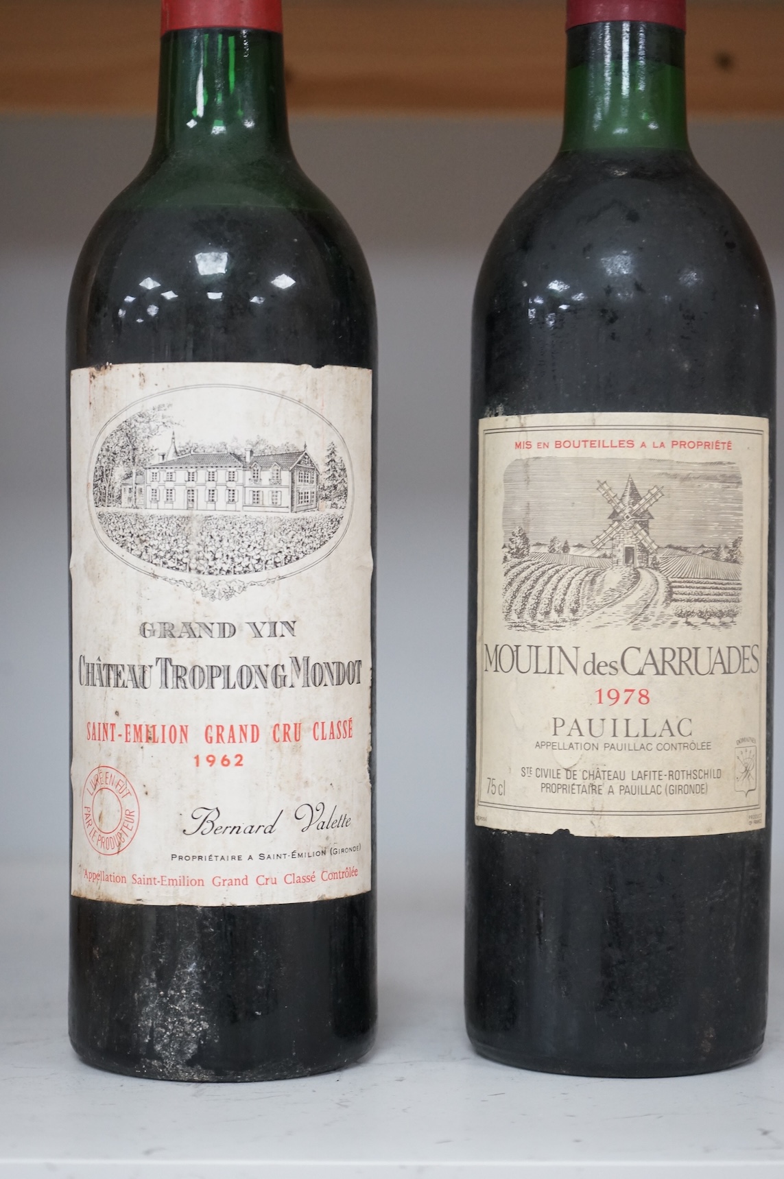 Two bottles of red wine; Chateau Troplong Mondot 1962 together with Moulin des Carruades 1978